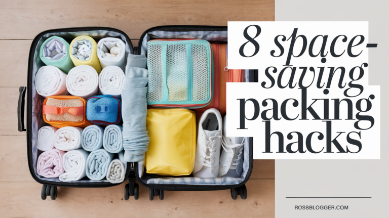 An open suitcase with rolled clothes, packing cubes, and travel essentials neatly arranged on a sunlit bed.